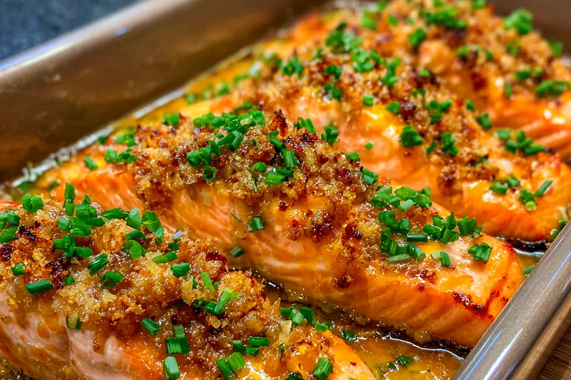 Chef Mitchell grilling Zesty Bang Bang Salmon Delight with precise technique.